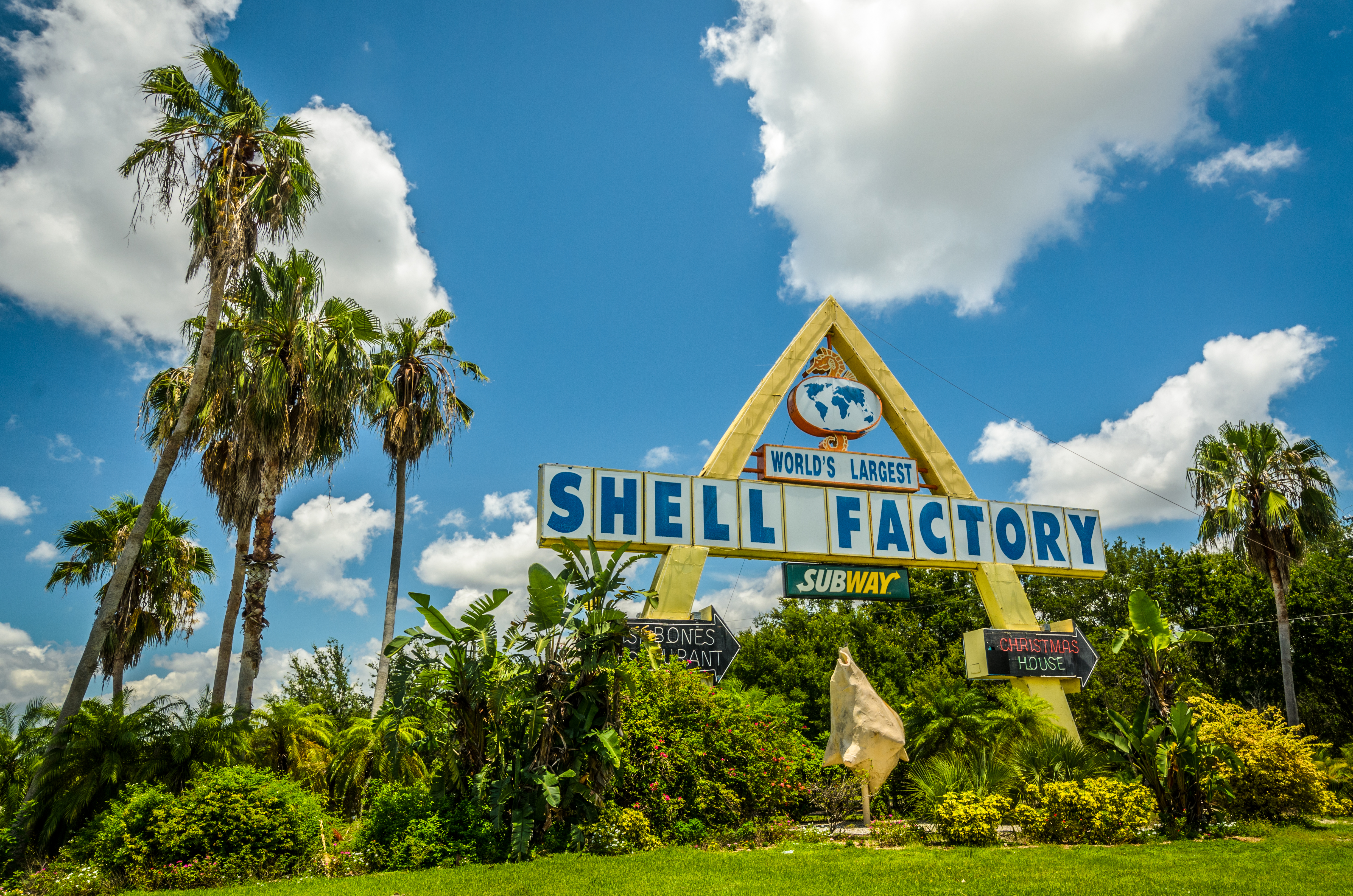 The shell factory sign off the side of the road