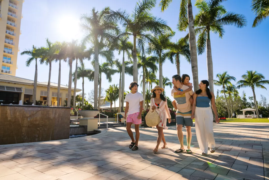 Family Walking Outside Hyatt Regency Coconut Point Resort &amp; Spa