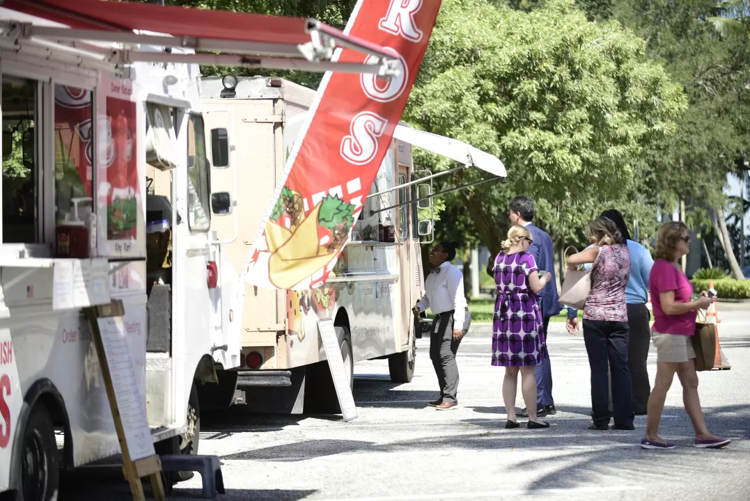 Group of people eating at a food truck