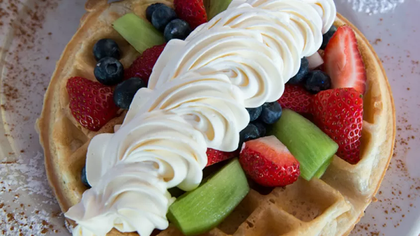 Waffles with Strawberries, Blueberries, and Whipped Cream 