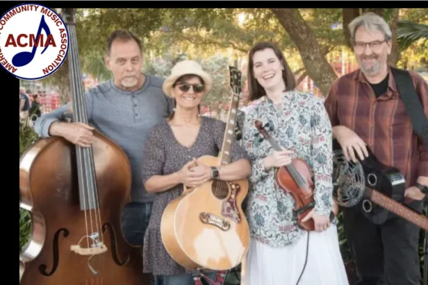 Four musicians standing, with upright bass, guitar, violin and dobro
