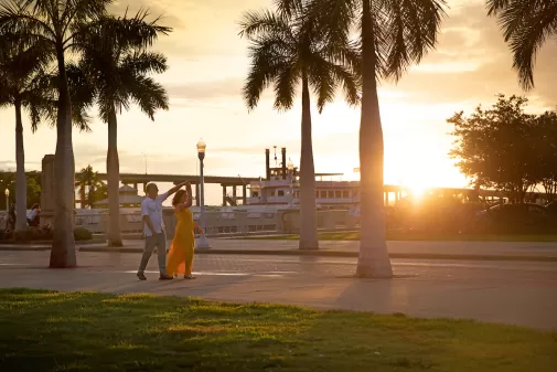 Couple walking at sunset in Fort Myers