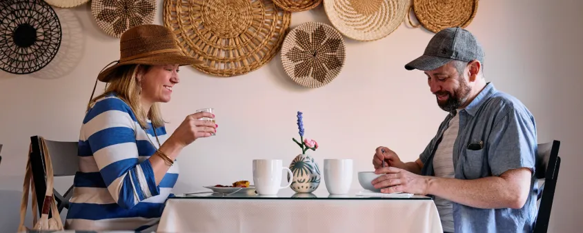A couple enjoys breakfast at the Hibiscus House B&B