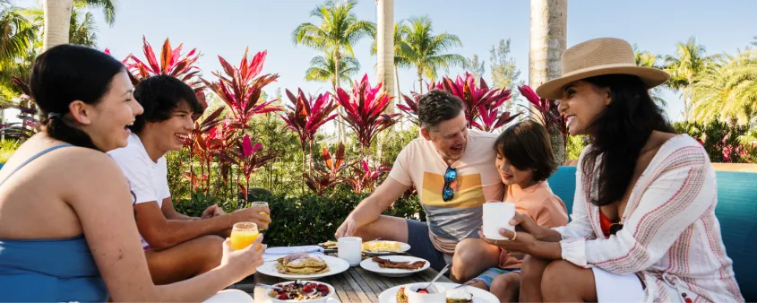 A family enjoys an outdoor meal together