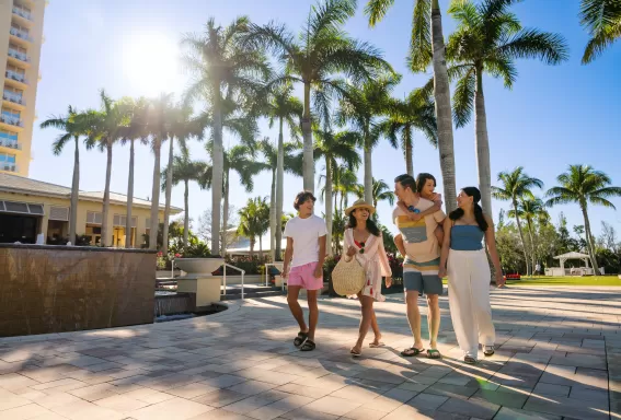 Family Walking Outside Hyatt Regency Coconut Point Resort & Spa