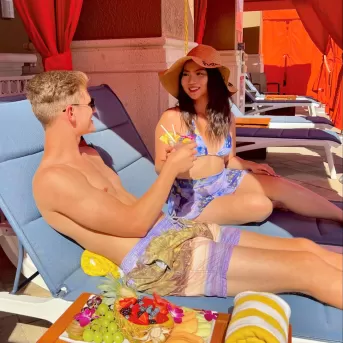 A couple of people that are sitting in chairs