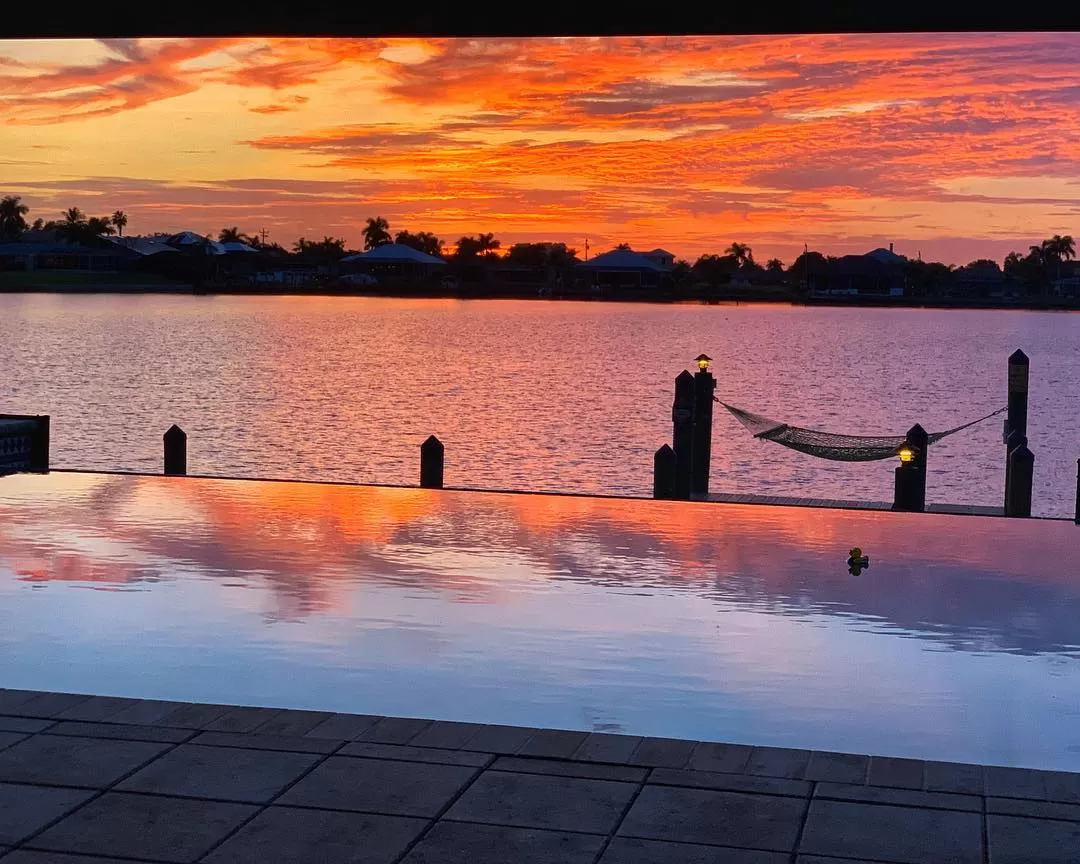 sunset view overlooking pool and water